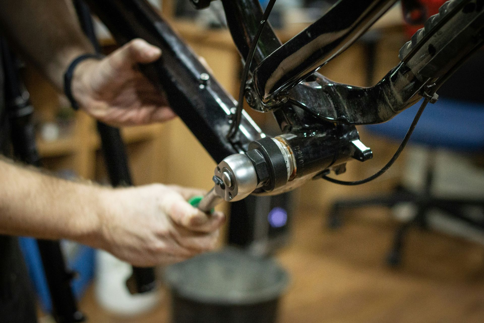 a close up of a person working on a bike